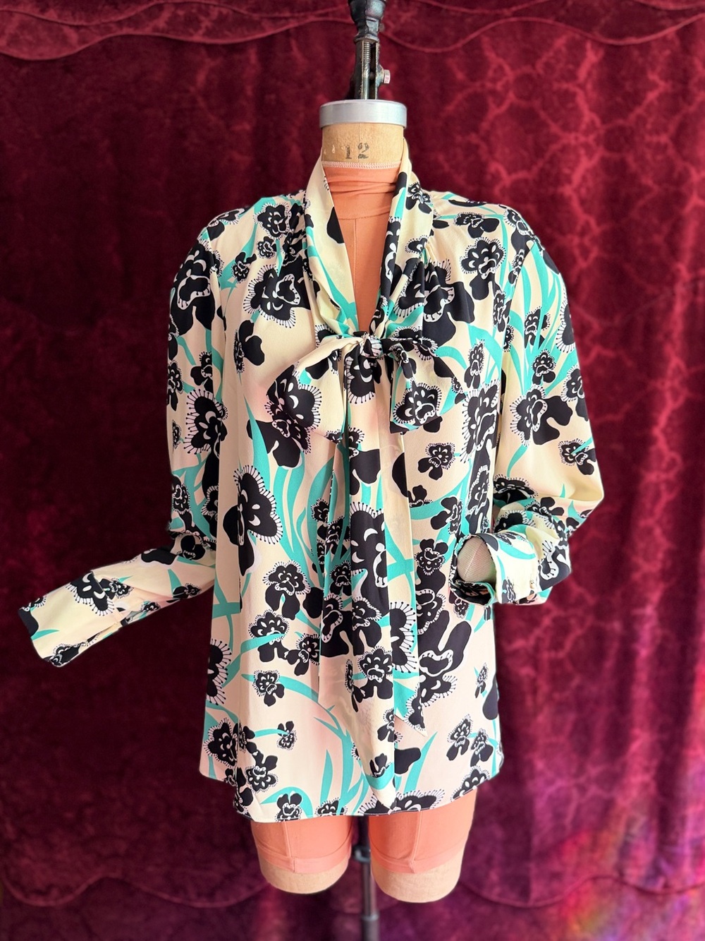 St. John Cream Yellow Blouse with Black Floral and Green Accents Bow-Tie Neck